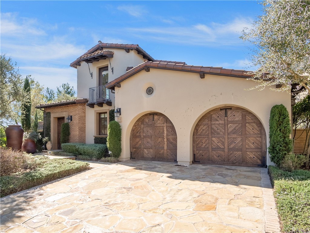 Undisclosed Address Newport Coast, CA 92657 - Photo 1 of 1 a front view of a house with garden