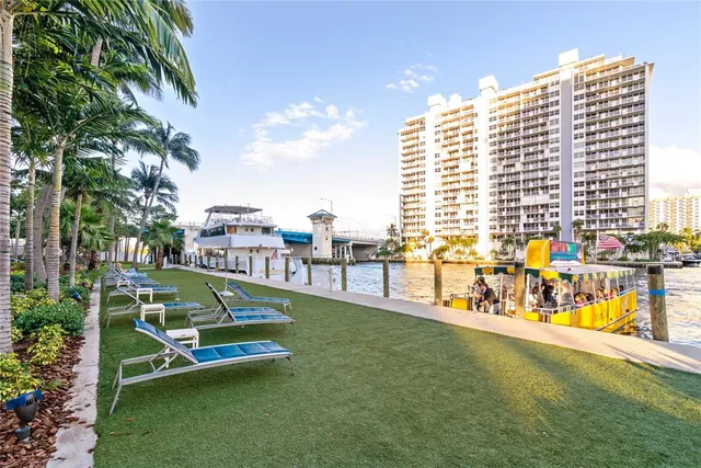 a view of a swimming pool with a lawn chairs and a lawn chairs