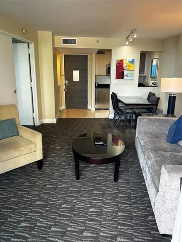 a living room with couches and a table