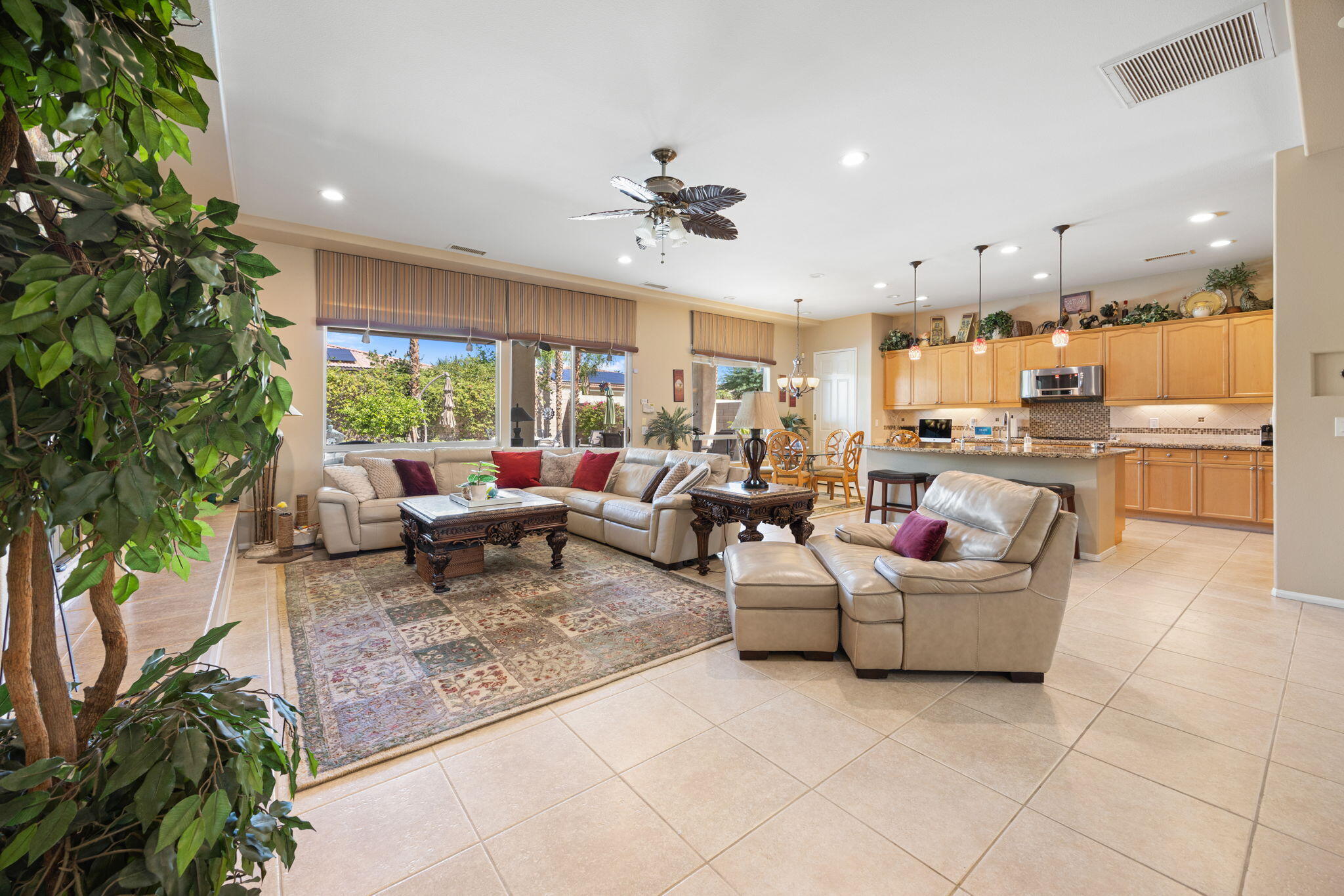 74068 Kokopelli Circle Palm Desert, CA 92211 - Photo 14 of 46 a living room with fireplace furniture and a potted plant