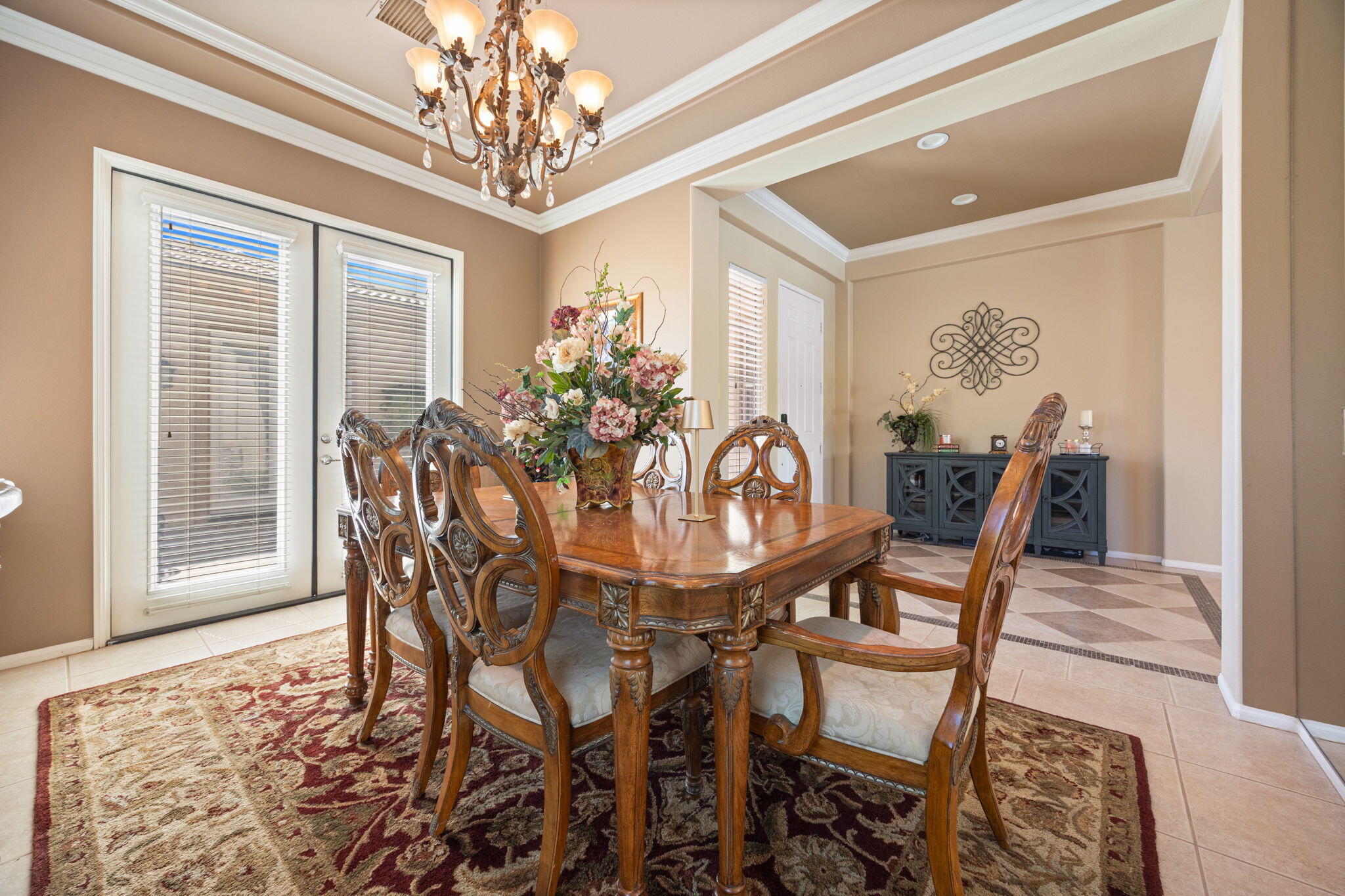 74068 Kokopelli Circle Palm Desert, CA 92211 - Photo 17 of 46 a view of a dining room with furniture and chandelier