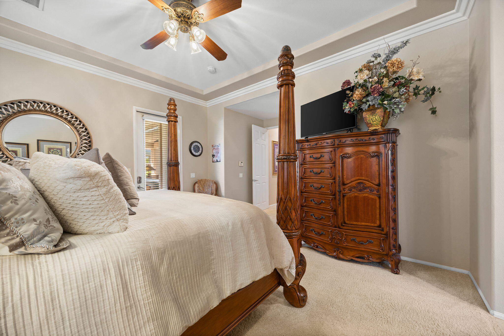 74068 Kokopelli Circle Palm Desert, CA 92211 - Photo 21 of 46 a bedroom with a bed and a chandelier