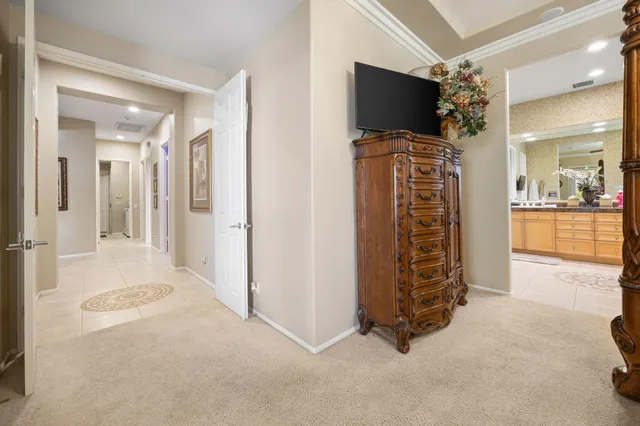 en empty room with furniture and a flat screen tv