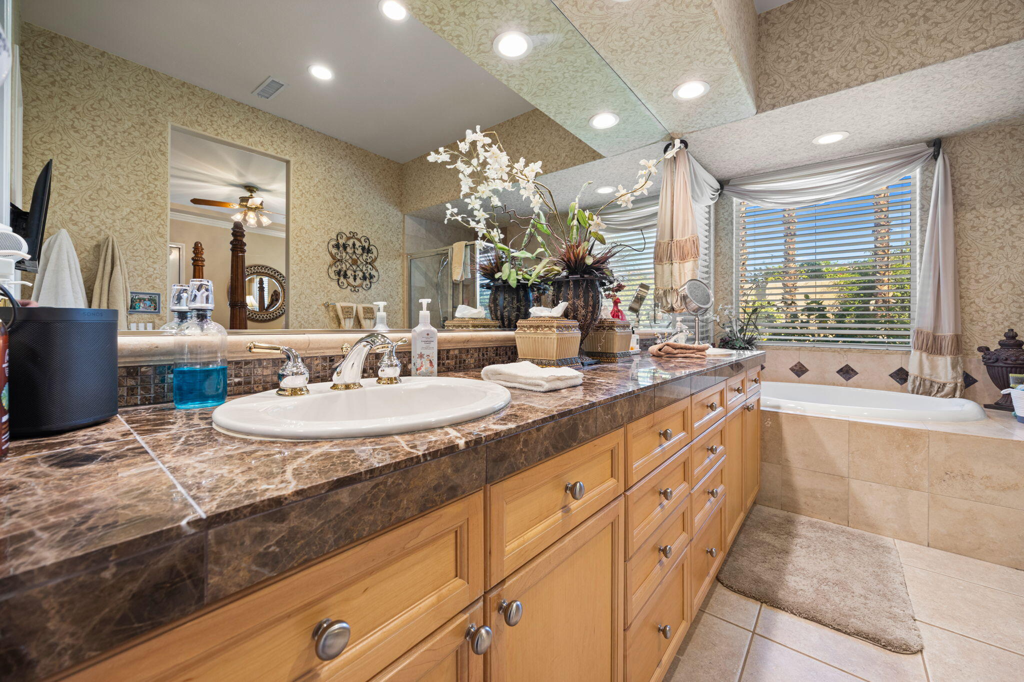 74068 Kokopelli Circle Palm Desert, CA 92211 - Photo 25 of 46 a large bathroom with double vanity and a bathtub
