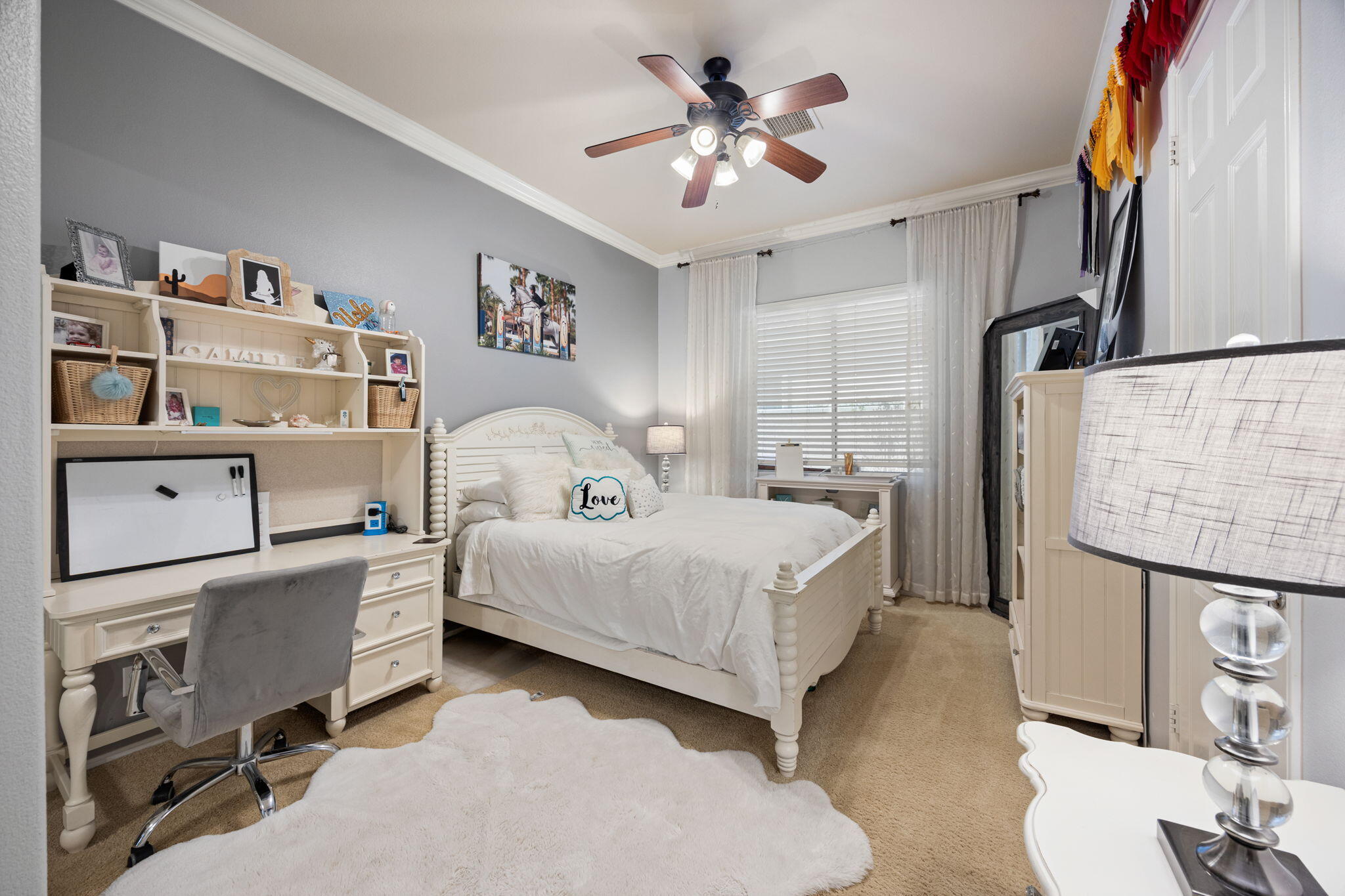 74068 Kokopelli Circle Palm Desert, CA 92211 - Photo 27 of 46 a bedroom with a bed and a book shelf