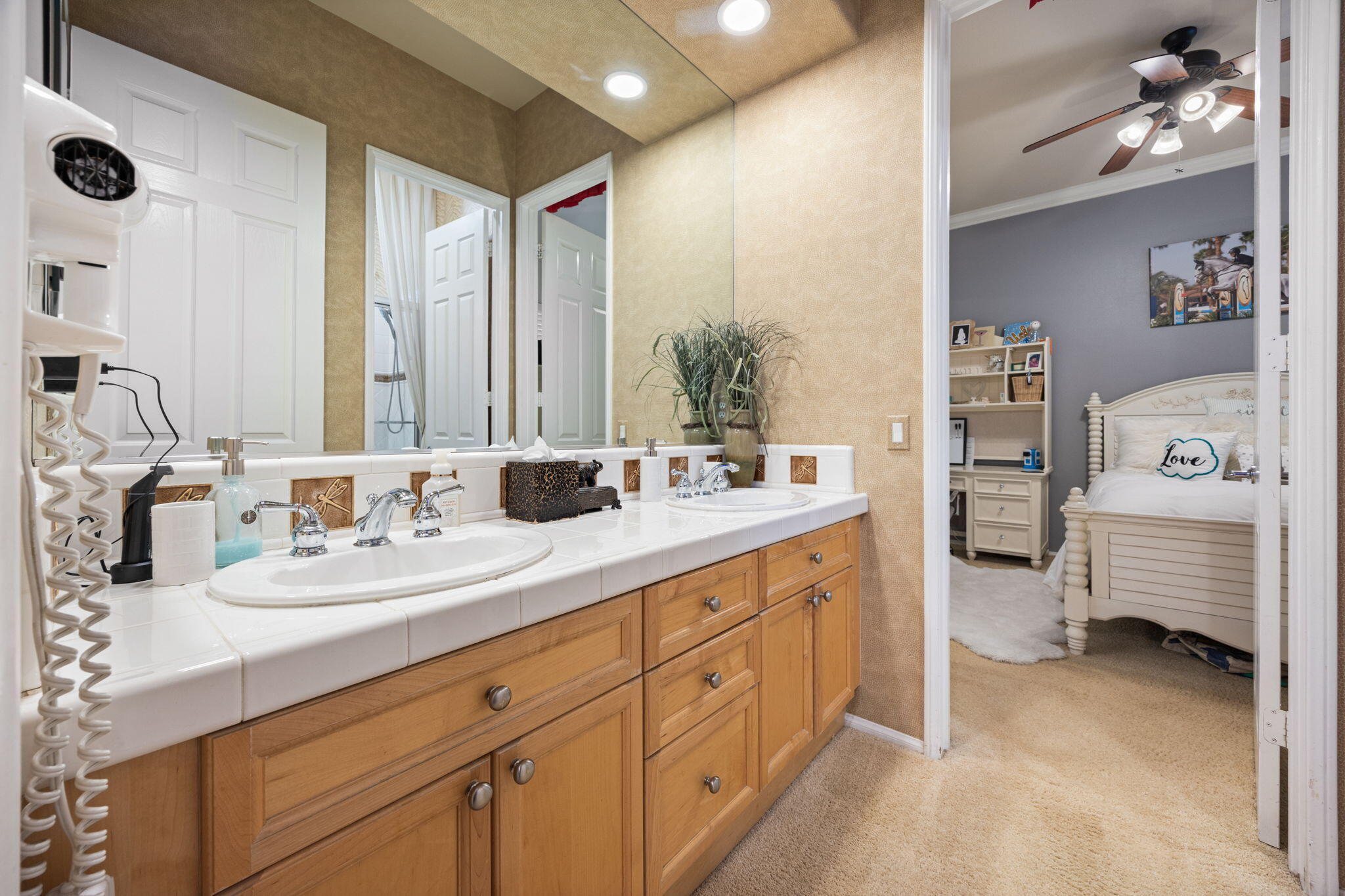 74068 Kokopelli Circle Palm Desert, CA 92211 - Photo 28 of 46 a en suite bathroom with double sink and a mirror