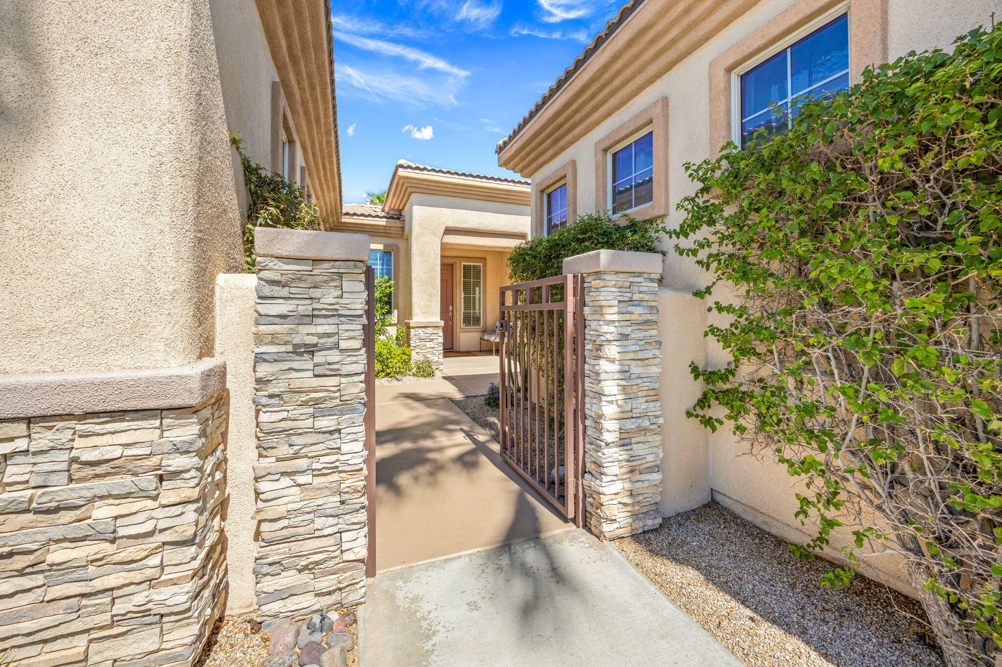 74068 Kokopelli Circle Palm Desert, CA 92211 - Photo 3 of 46 a view of a brick building with many windows