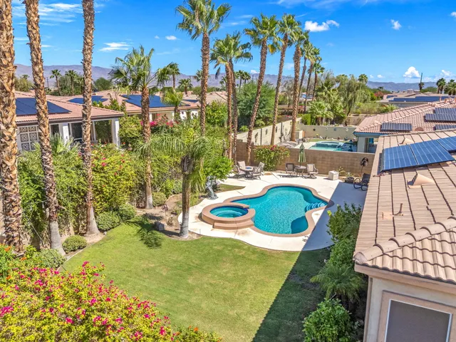 a view of a chair and tables in the patio