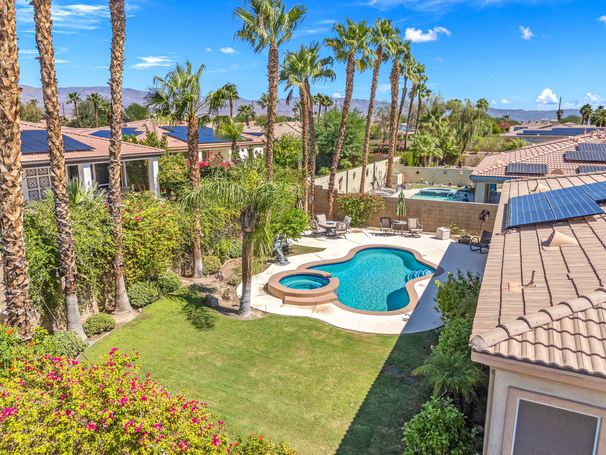 74068 Kokopelli Circle Palm Desert, CA 92211 - Photo 38 of 46 a view of a chair and tables in the patio