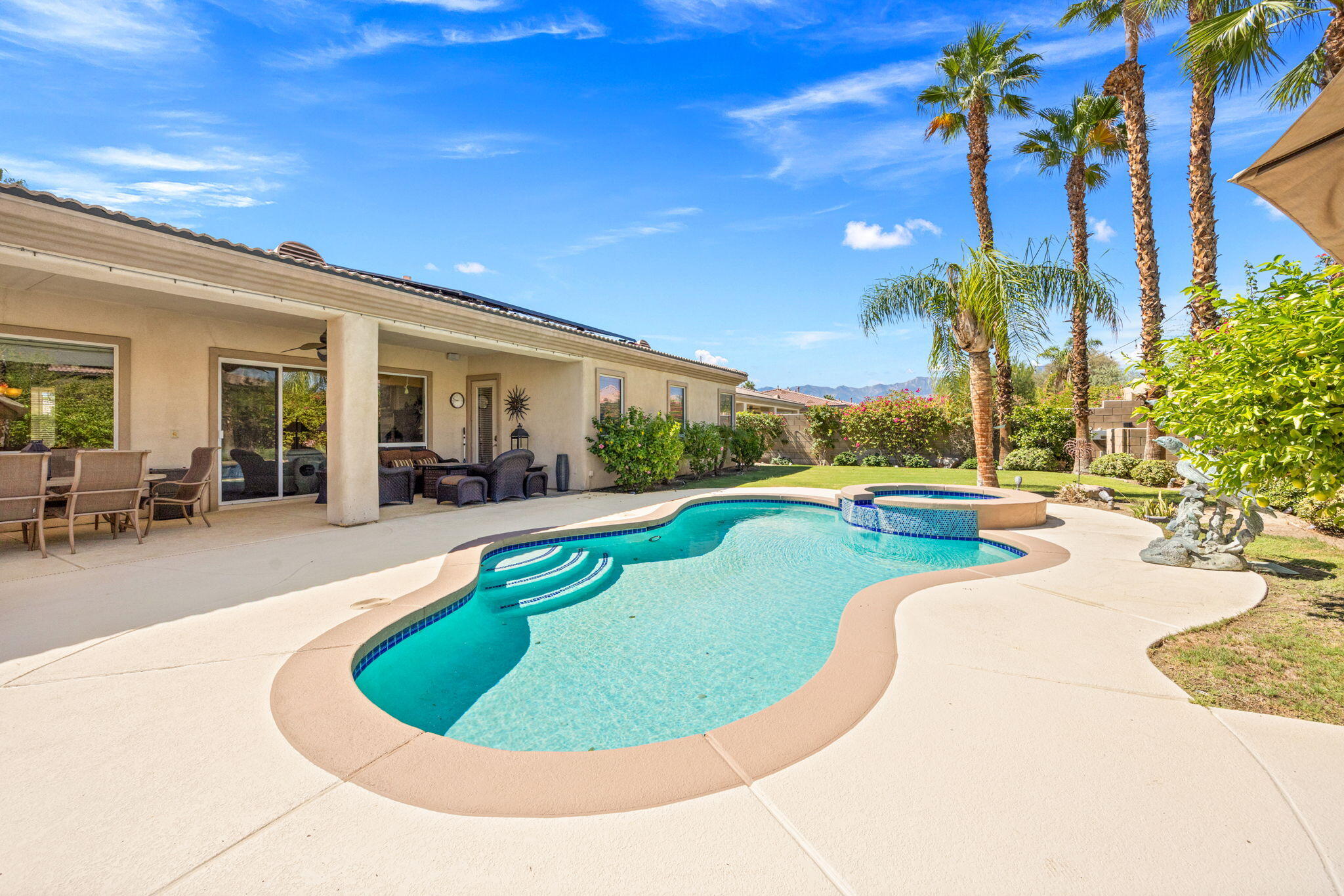 74068 Kokopelli Circle Palm Desert, CA 92211 - Photo 39 of 46 a view of a swimming pool with a patio