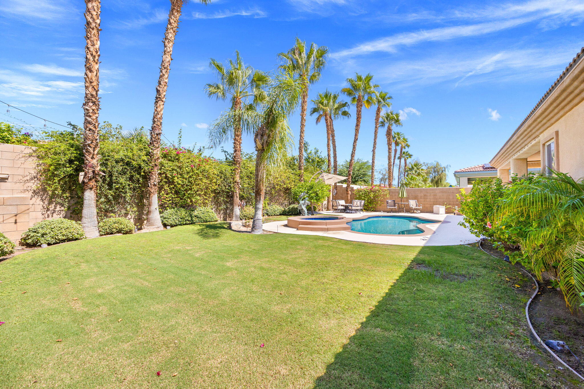 74068 Kokopelli Circle Palm Desert, CA 92211 - Photo 41 of 46 a view of a swimming pool with an outdoor space and seating area