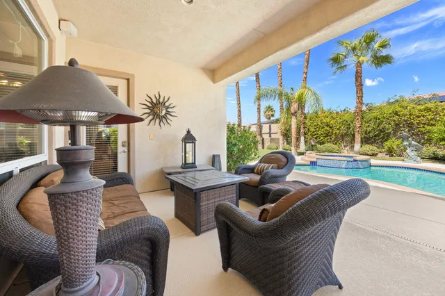 a view of a patio in the backyard