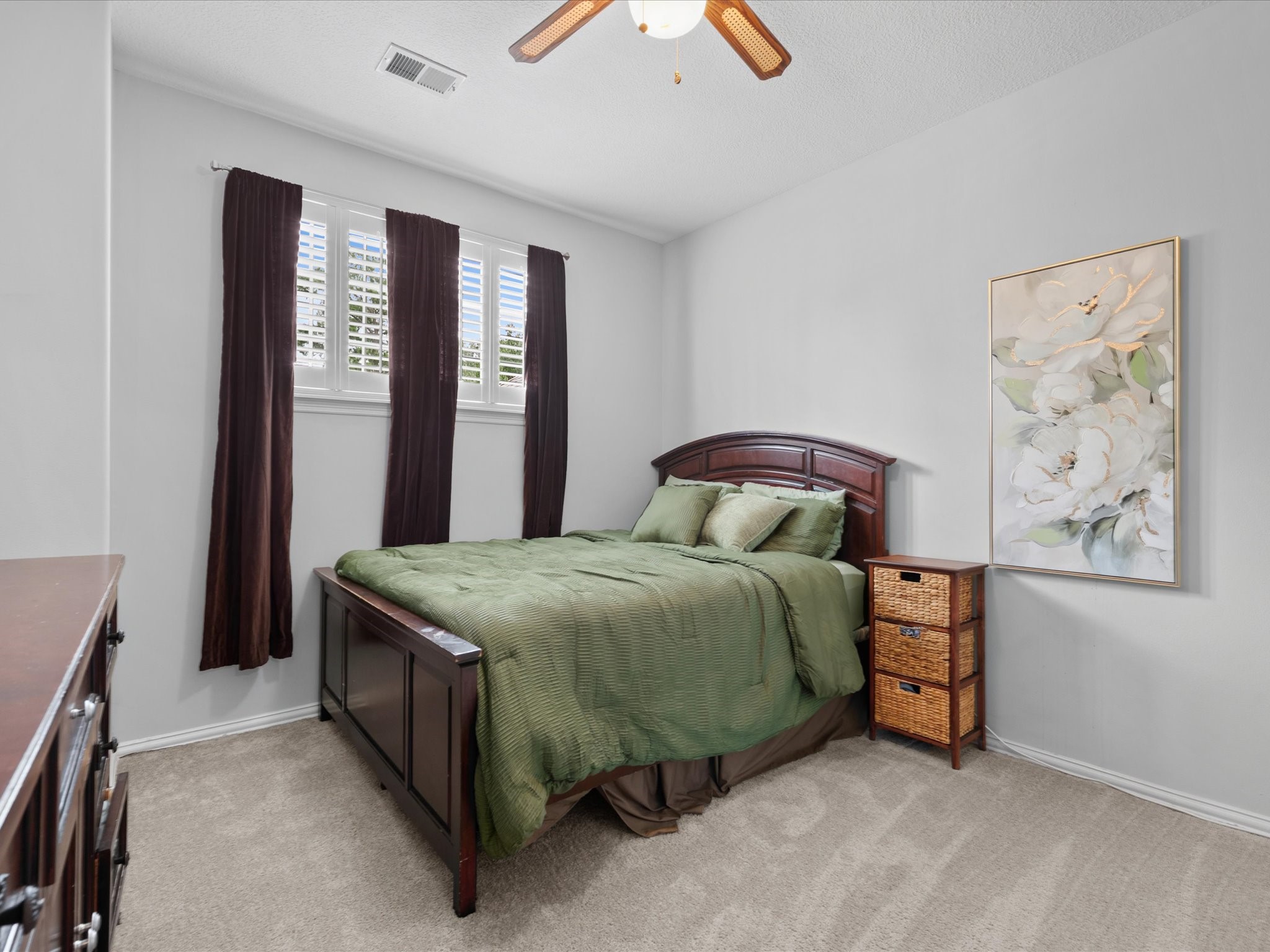 16123 Lafone Drive Spring, TX 77379 - Photo 27 of 47 Generously sized secondary bedrooms feature high ceilings and comfortable layouts, ensuring family members and guests alike feel right at home.