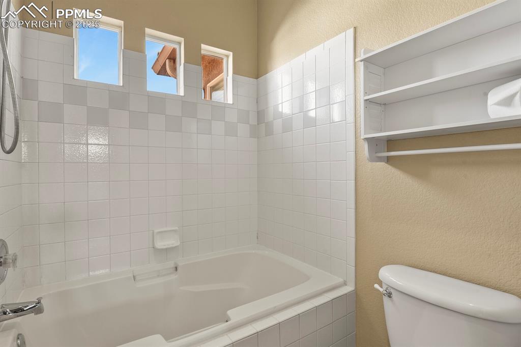 3271 Apogee View Colorado Springs, CO 80906 - Photo 23 of 37 a white bath tub sitting next to a white toilet