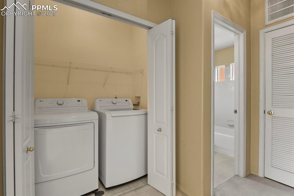 3271 Apogee View Colorado Springs, CO 80906 - Photo 28 of 37 a utility room with dryer and washer