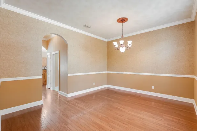 a very nice looking room with a ceiling fan and a window