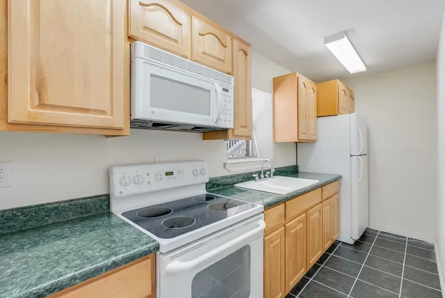 a view of balcony with wooden floor and fence