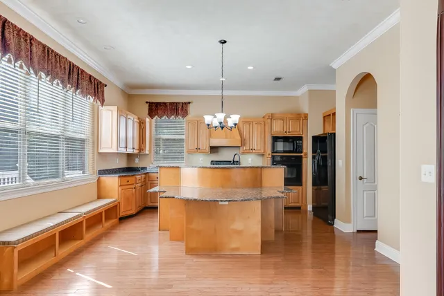 a room with furniture and wooden floor