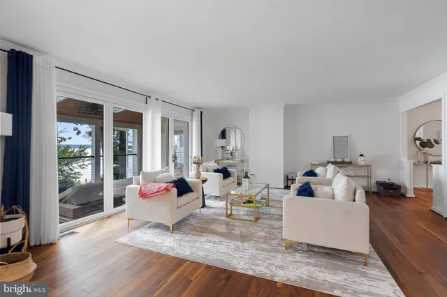 a living room with furniture or couch and a wooden floor