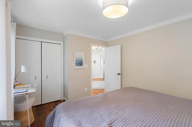 a bedroom with a bed and a lamp