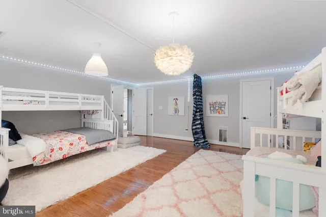 a bedroom with a bed and a table in it