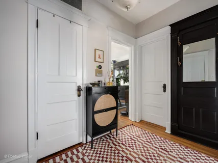 a room with a door and a mirror