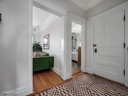 a room that has a mirror and a dresser in it