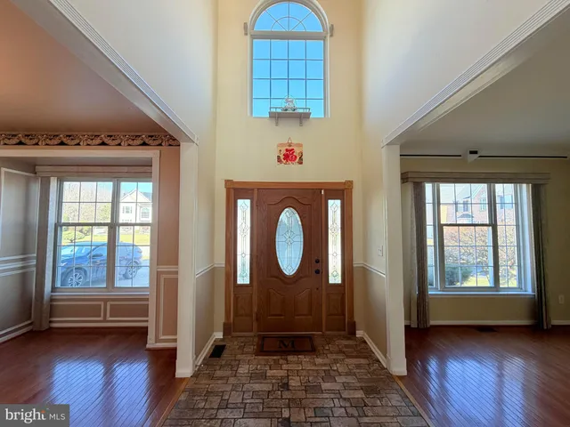 a view of entryway with wooden floor