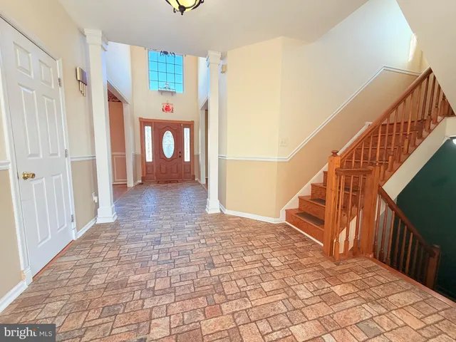 a view of an entryway with wooden floor