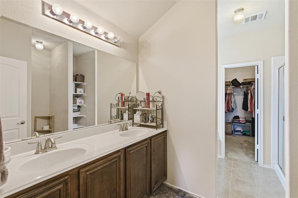 5491 Exeter Drive Prosper, TX 75078 - Photo 13 of 20 a bathroom with a sink double vanity and a mirror