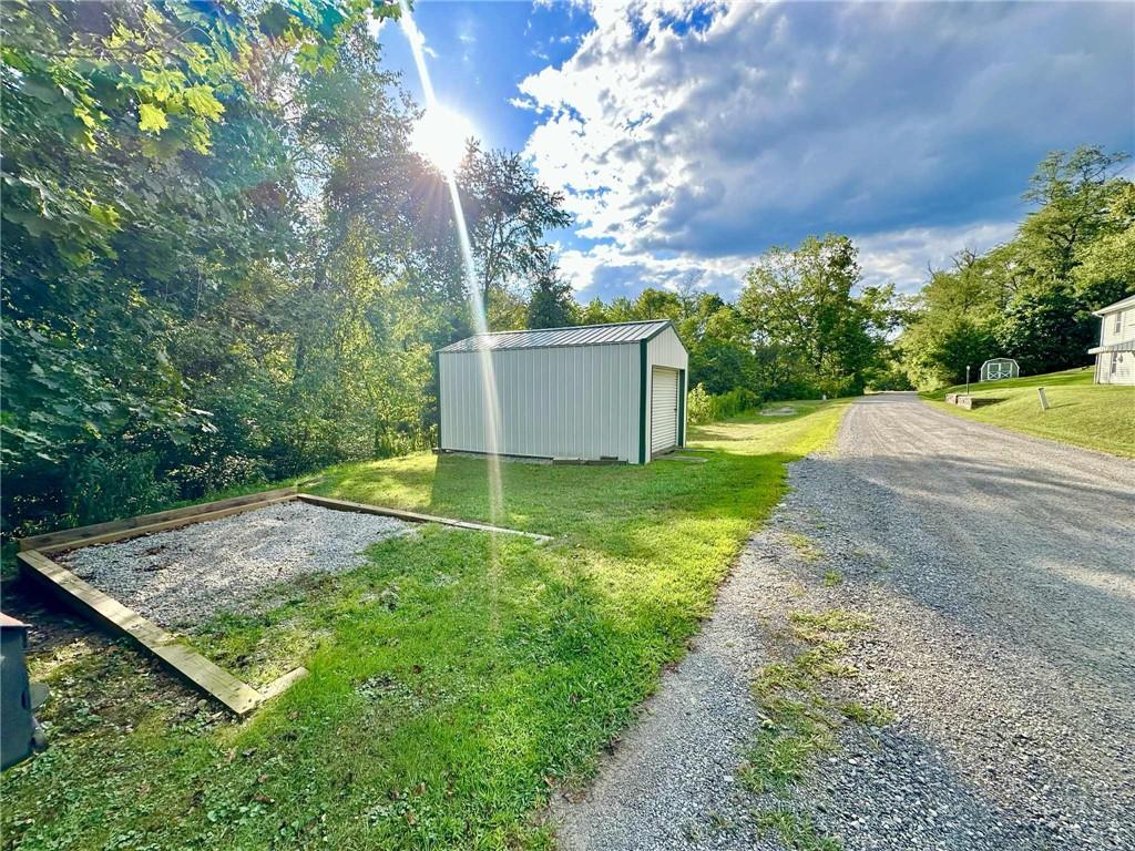 143 Raineytown Road Dawson, PA 15428 - Photo 12 of 42 a view of a backyard with swimming pool