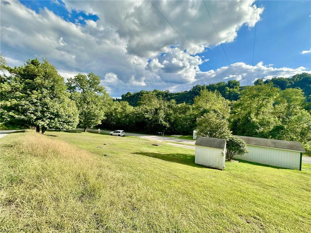 143 Raineytown Road Dawson, PA 15428 - Photo 14 of 42 a view of an outdoor space and swimming pool