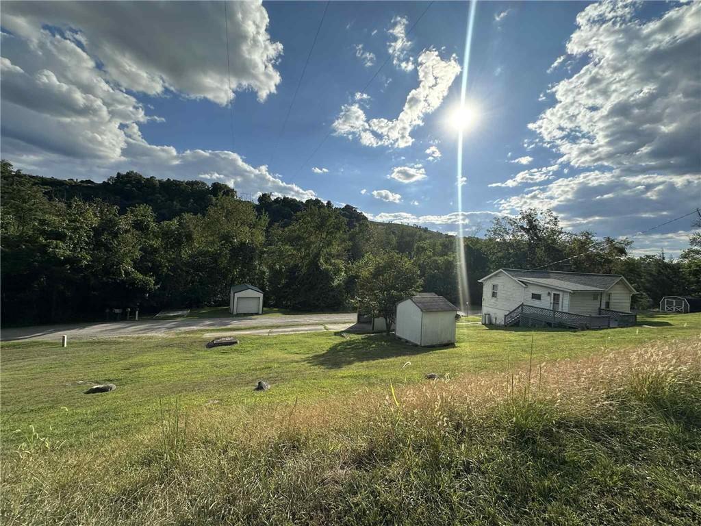 143 Raineytown Road Dawson, PA 15428 - Photo 15 of 42 a view of a swimming pool with a yard