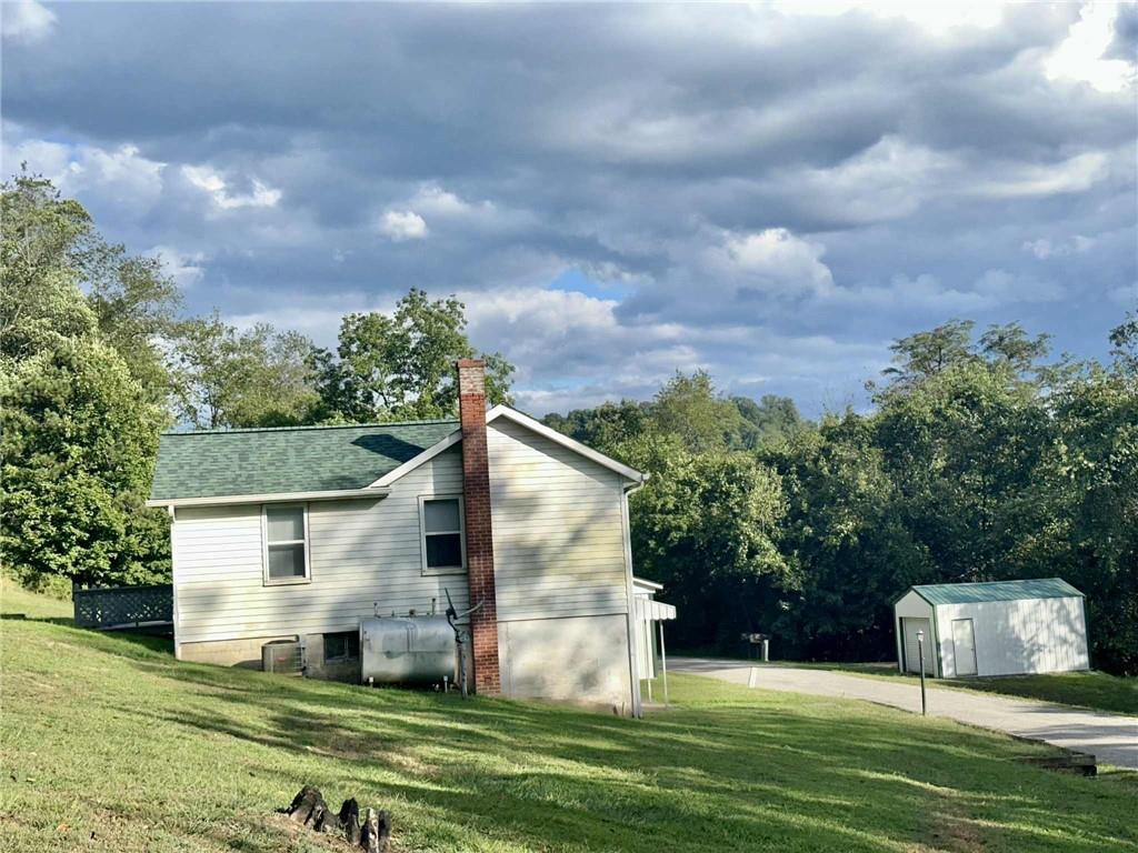143 Raineytown Road Dawson, PA 15428 - Photo 22 of 42 a view of a back yard of the house