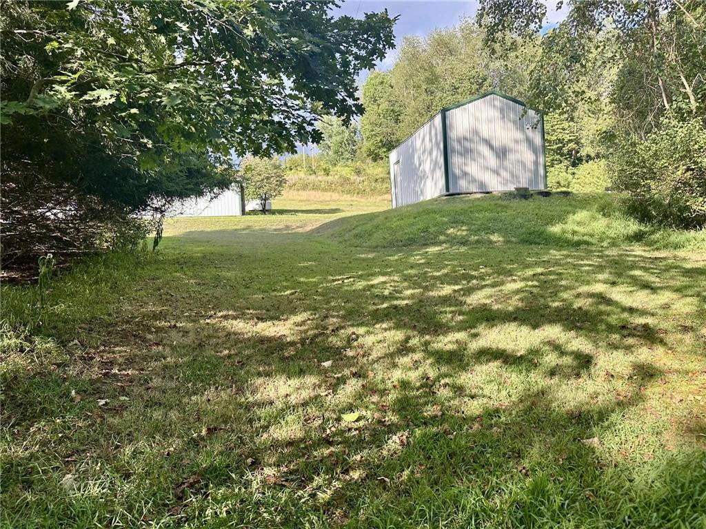 143 Raineytown Road Dawson, PA 15428 - Photo 23 of 42 a view of a field with a tree