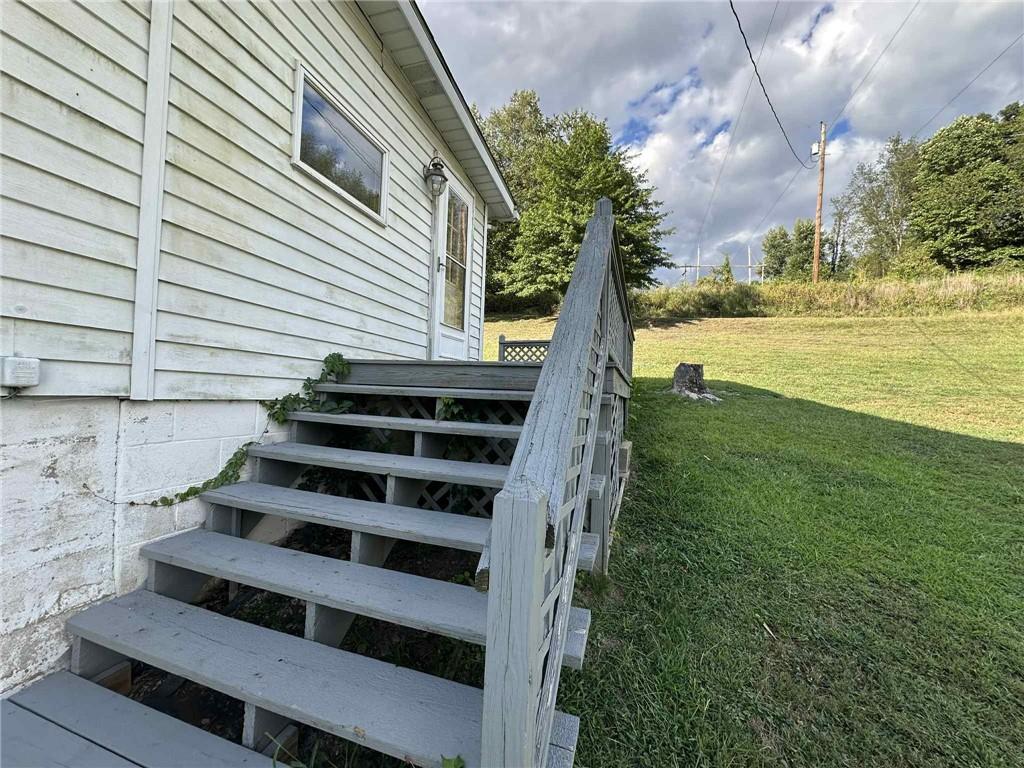 143 Raineytown Road Dawson, PA 15428 - Photo 26 of 42 a view of a yard with wooden fence