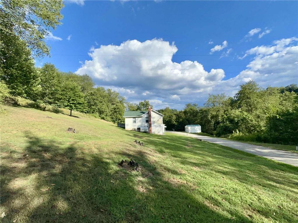 143 Raineytown Road Dawson, PA 15428 - Photo 28 of 42 a view of a big yard with large trees