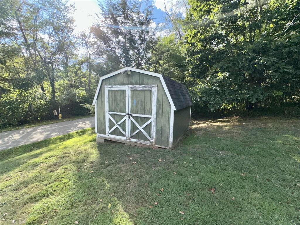 143 Raineytown Road Dawson, PA 15428 - Photo 29 of 42 a view of outdoor space with deck and yard