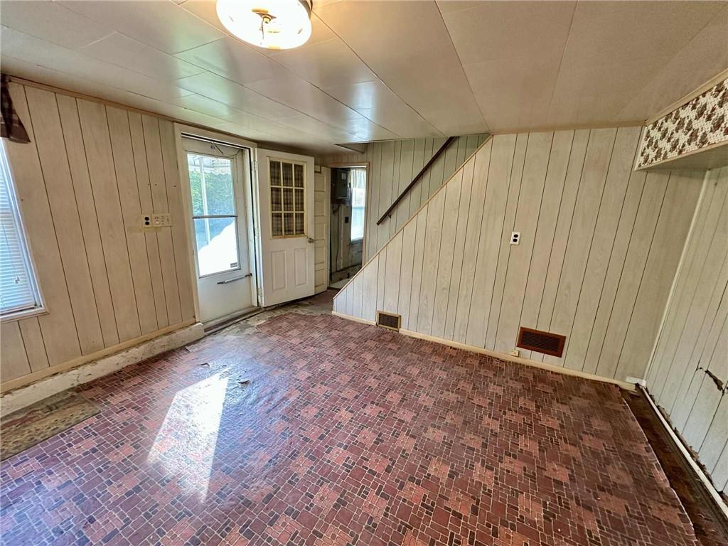 143 Raineytown Road Dawson, PA 15428 - Photo 40 of 42 a view of a big room with wooden floor and windows