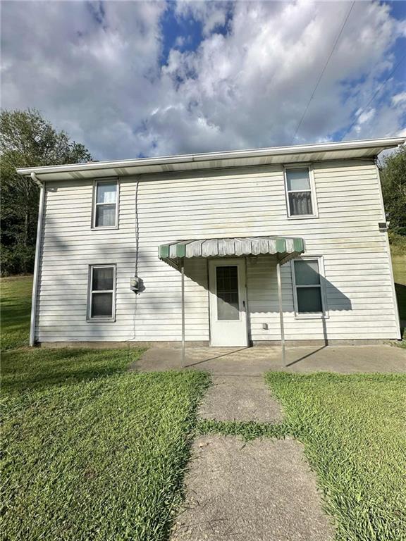 143 Raineytown Road Dawson, PA 15428 - Photo 6 of 42 a front view of a house with a yard