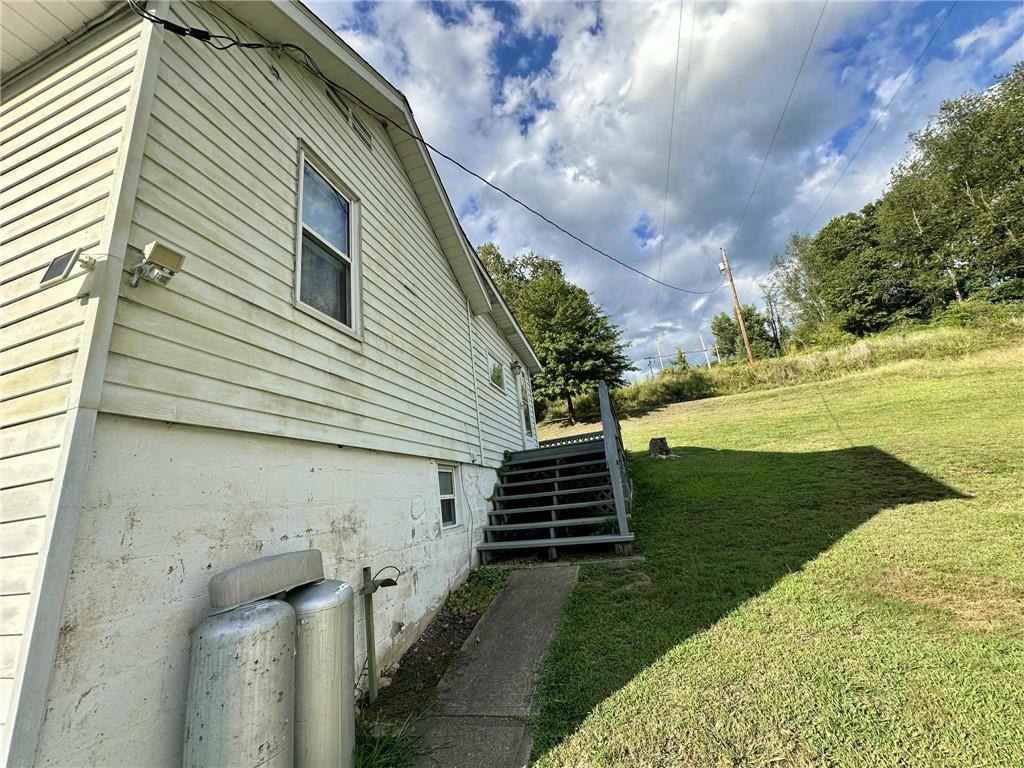 143 Raineytown Road Dawson, PA 15428 - Photo 7 of 42 a view of a backyard of the house