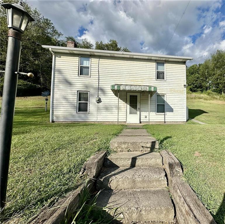 143 Raineytown Road Dawson, PA 15428 - Photo 8 of 42 a view of house with backyard