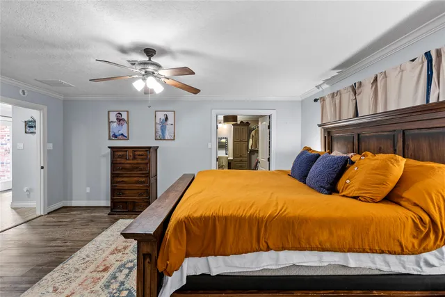 a bed room with a bed and a chandelier
