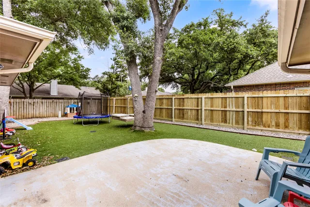 a view of a house with a yard and sitting area