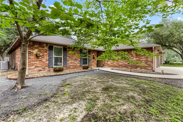 a view of a trees in front of a house