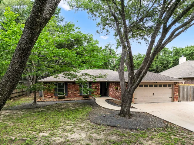 a view of a house with backyard porch and sitting area