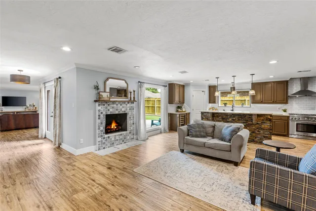 a living room with furniture and a fireplace