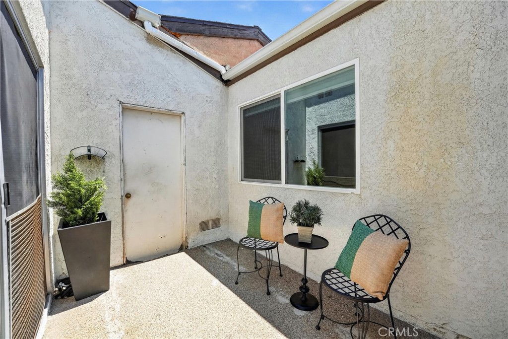 2901 West Ball Road, Unit 4 Anaheim, CA 92804 - Photo 45 of 61 Atrium - access to garage and hall way slider