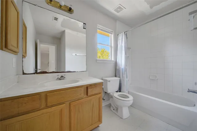 a bathroom with a sink a toilet and a bathtub