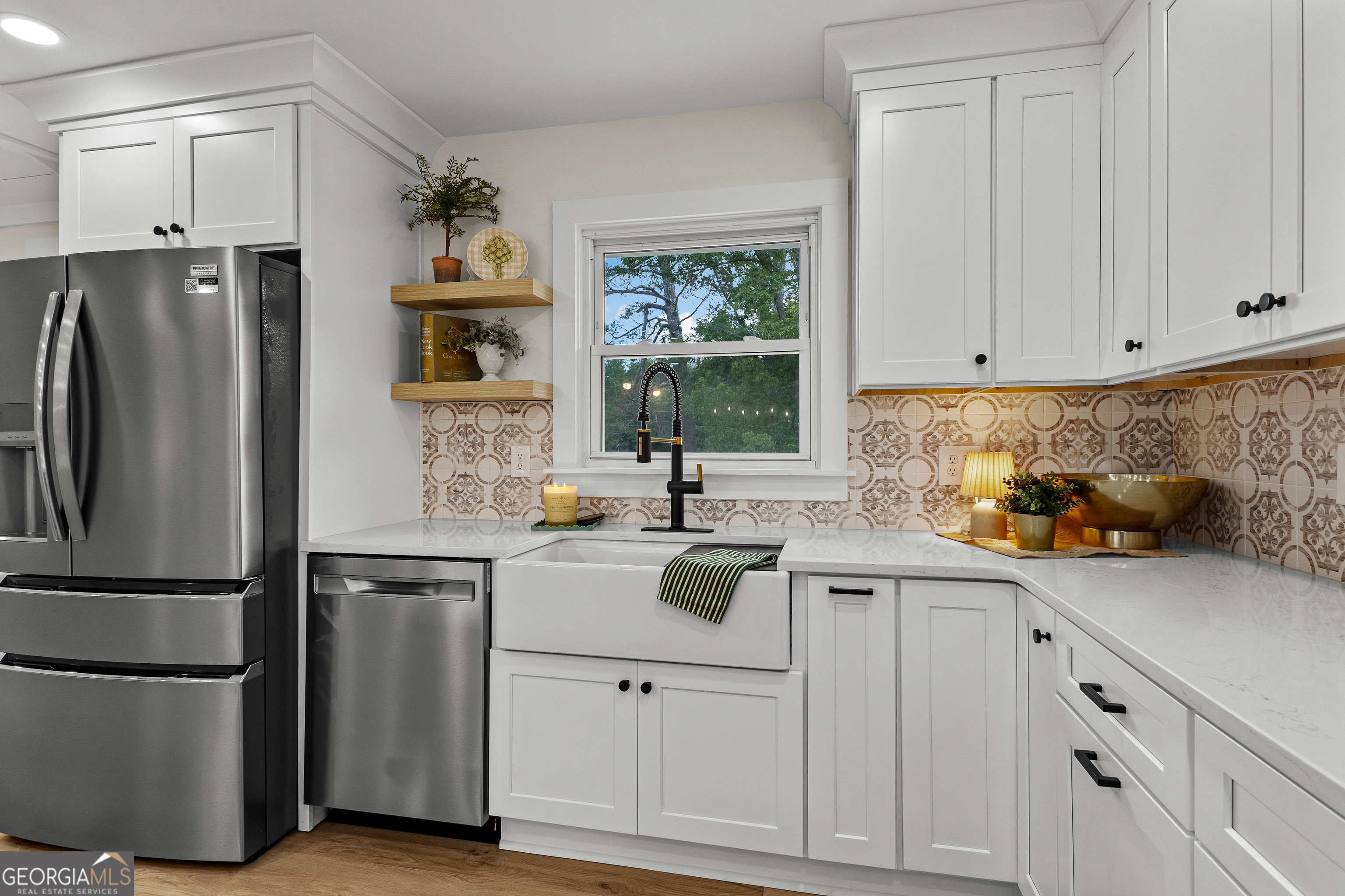 1367 Sharpsburg McCollum Road Sharpsburg, GA 30277 - Photo 16 of 80 a kitchen with a sink stainless steel appliances and cabinets